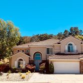 a front view of a house with a yard