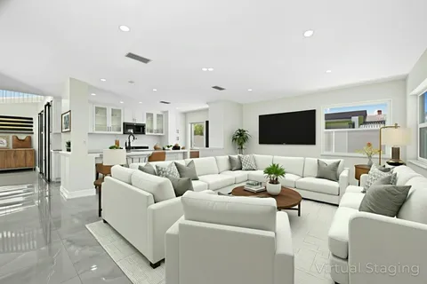 a view of kitchen with refrigerator and window