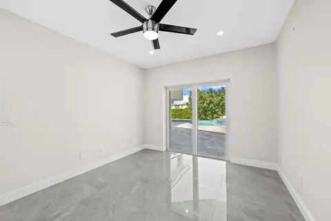 a bathroom with a sink toilet a mirror and shower