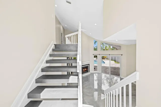 a view of porch with a floor to ceiling window and wooden floor