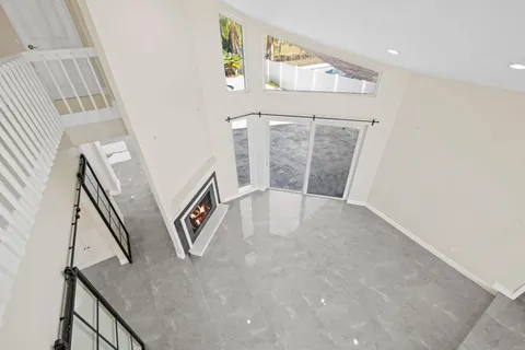 a view of an entryway with wooden floor