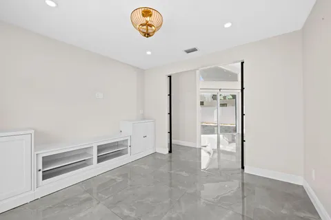 a kitchen with sink and refrigerator