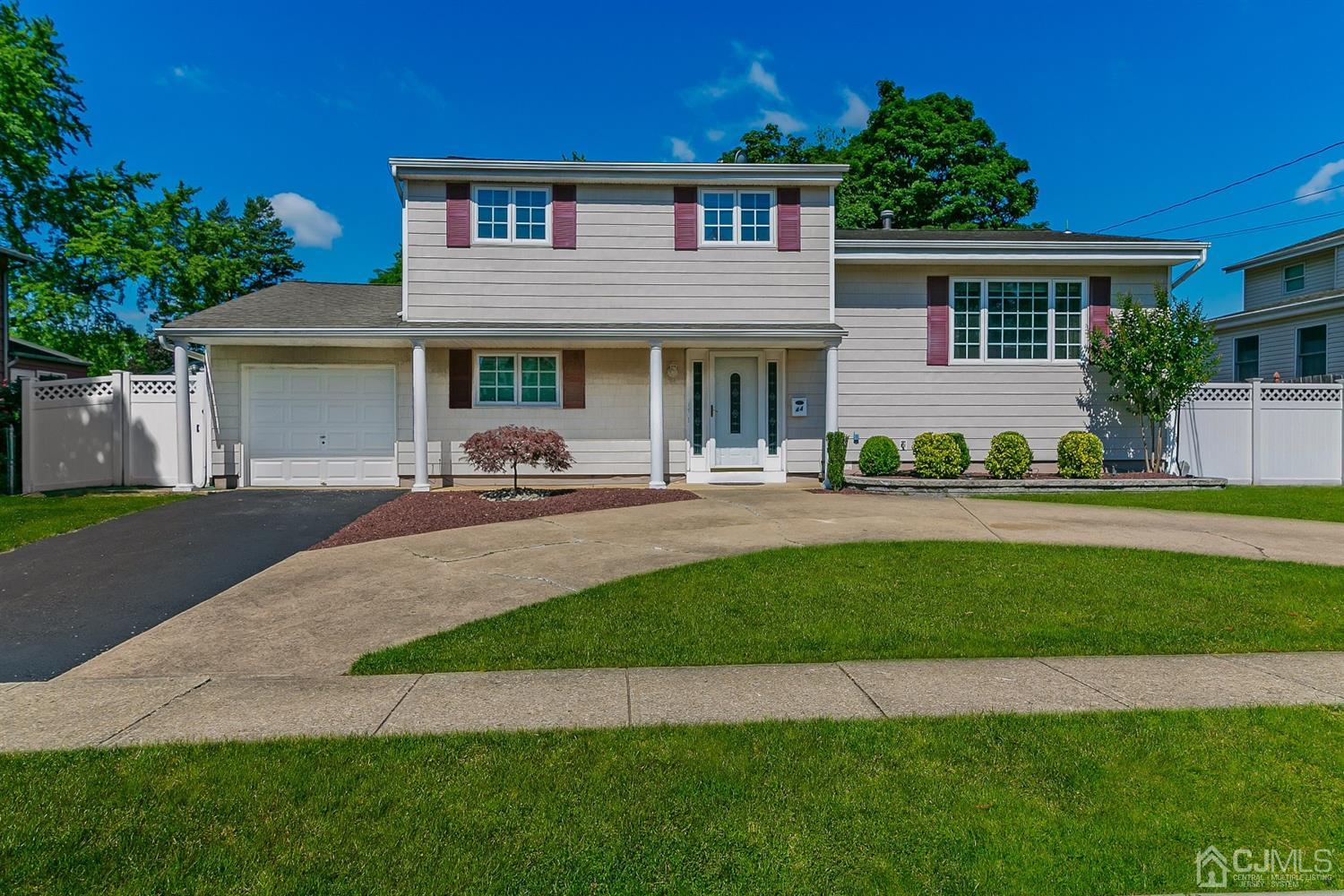 44 Gramercy Road Old Bridge, NJ 08857 - Photo 1 of 27 a front view of a house with a yard