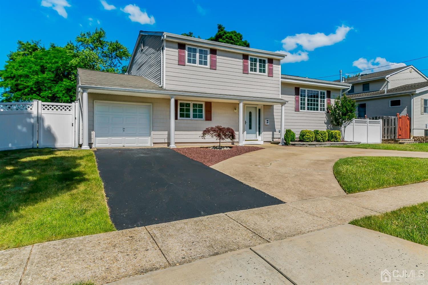 44 Gramercy Road Old Bridge, NJ 08857 - Photo 2 of 27 front view of a house with a yard