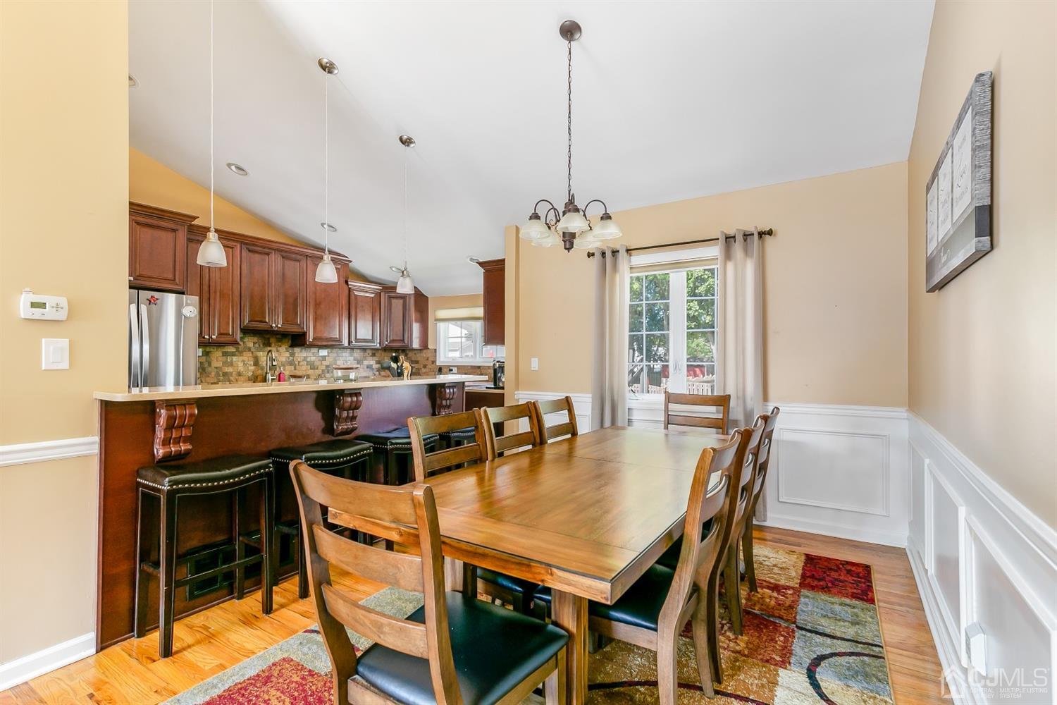 44 Gramercy Road Old Bridge, NJ 08857 - Photo 11 of 27 a view of a dining room with furniture and a chandelier