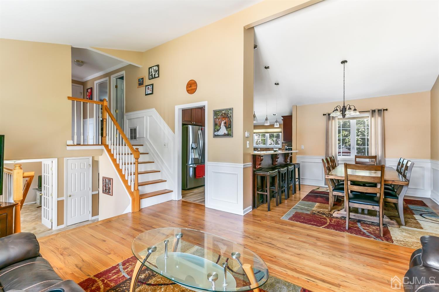 44 Gramercy Road Old Bridge, NJ 08857 - Photo 12 of 27 a living room with lots of furniture and a wooden floor