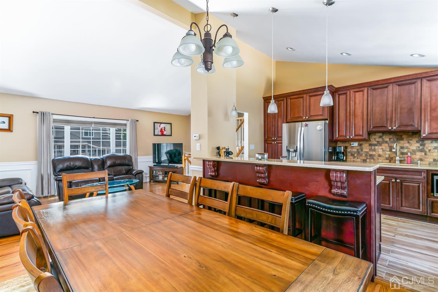 44 Gramercy Road Old Bridge, NJ 08857 - Photo 13 of 27 a living room with furniture a flat screen tv and kitchen view