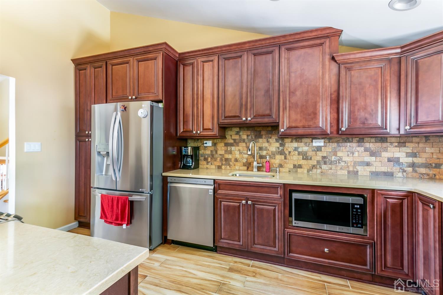 44 Gramercy Road Old Bridge, NJ 08857 - Photo 15 of 27 a kitchen with stainless steel appliances granite countertop a refrigerator stove and sink