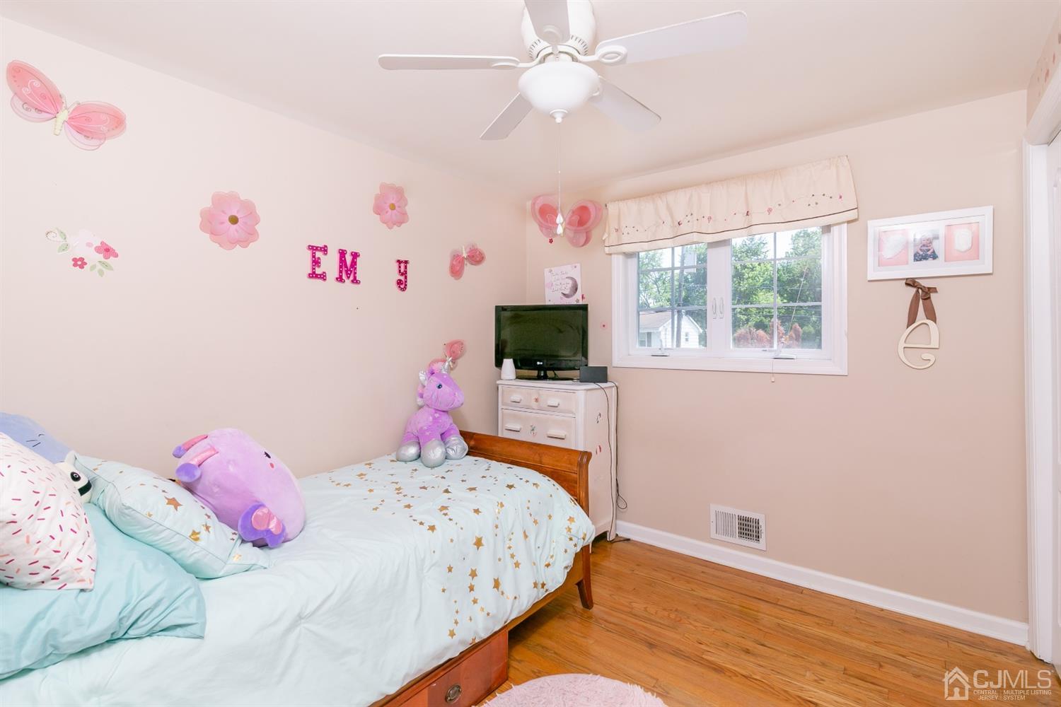 44 Gramercy Road Old Bridge, NJ 08857 - Photo 18 of 27 a bedroom with a bed and a flat screen tv