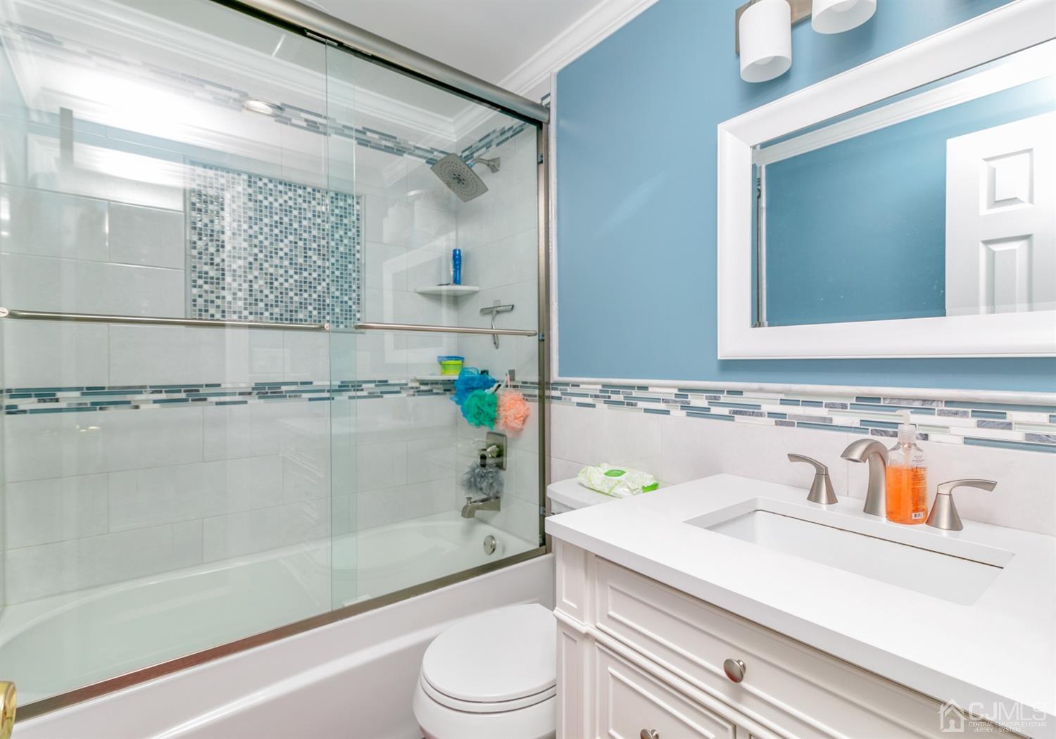 44 Gramercy Road Old Bridge, NJ 08857 - Photo 20 of 27 a bathroom with a sink a toilet and shower