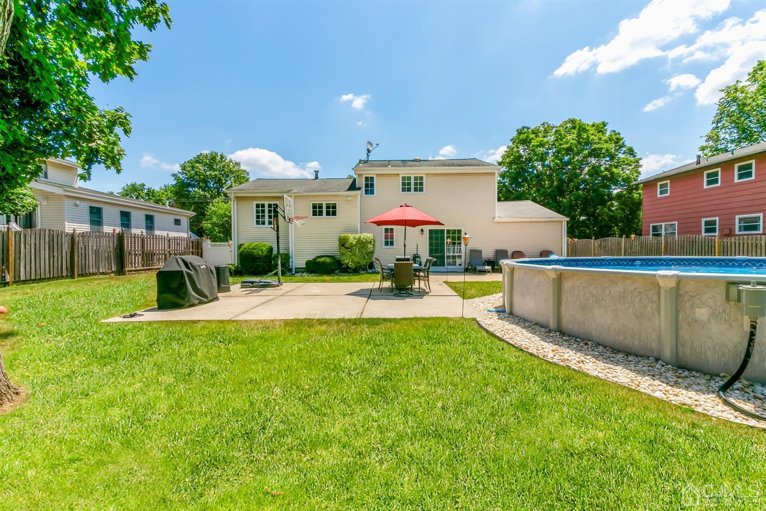 44 Gramercy Road Old Bridge, NJ 08857 - Photo 22 of 27 a view of a house with a yard and sitting area