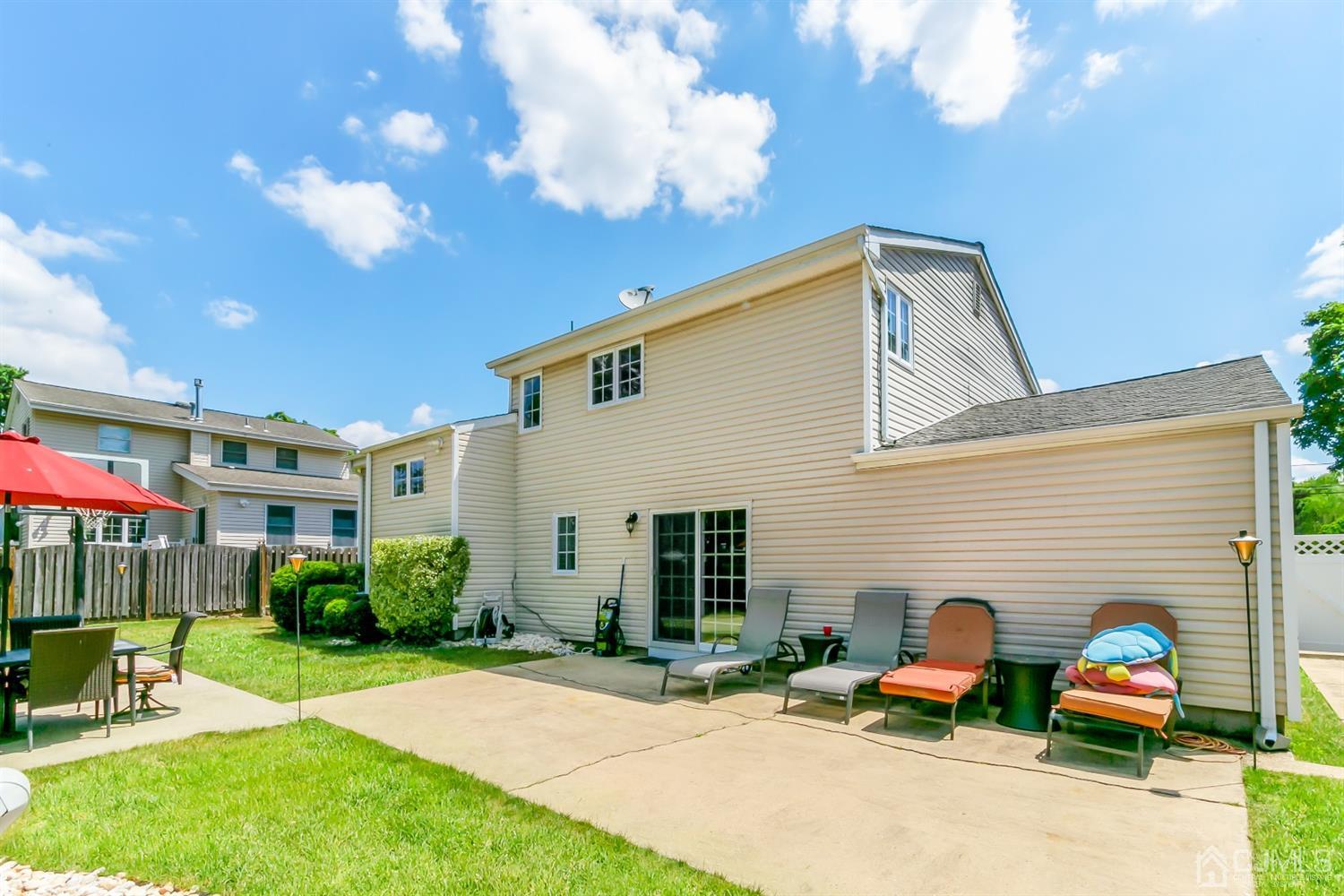 44 Gramercy Road Old Bridge, NJ 08857 - Photo 24 of 27 a view of house with backyard and outdoor seating