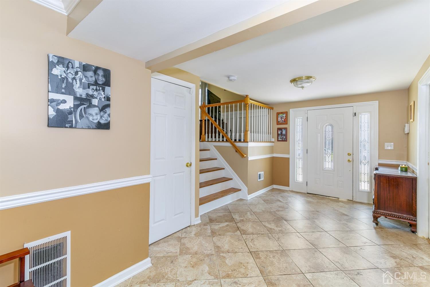 44 Gramercy Road Old Bridge, NJ 08857 - Photo 4 of 27 a view of a hallway with workspace and entryway