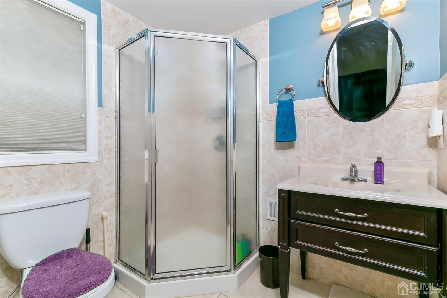 44 Gramercy Road Old Bridge, NJ 08857 - Photo 7 of 27 a bathroom with a sink and a mirror