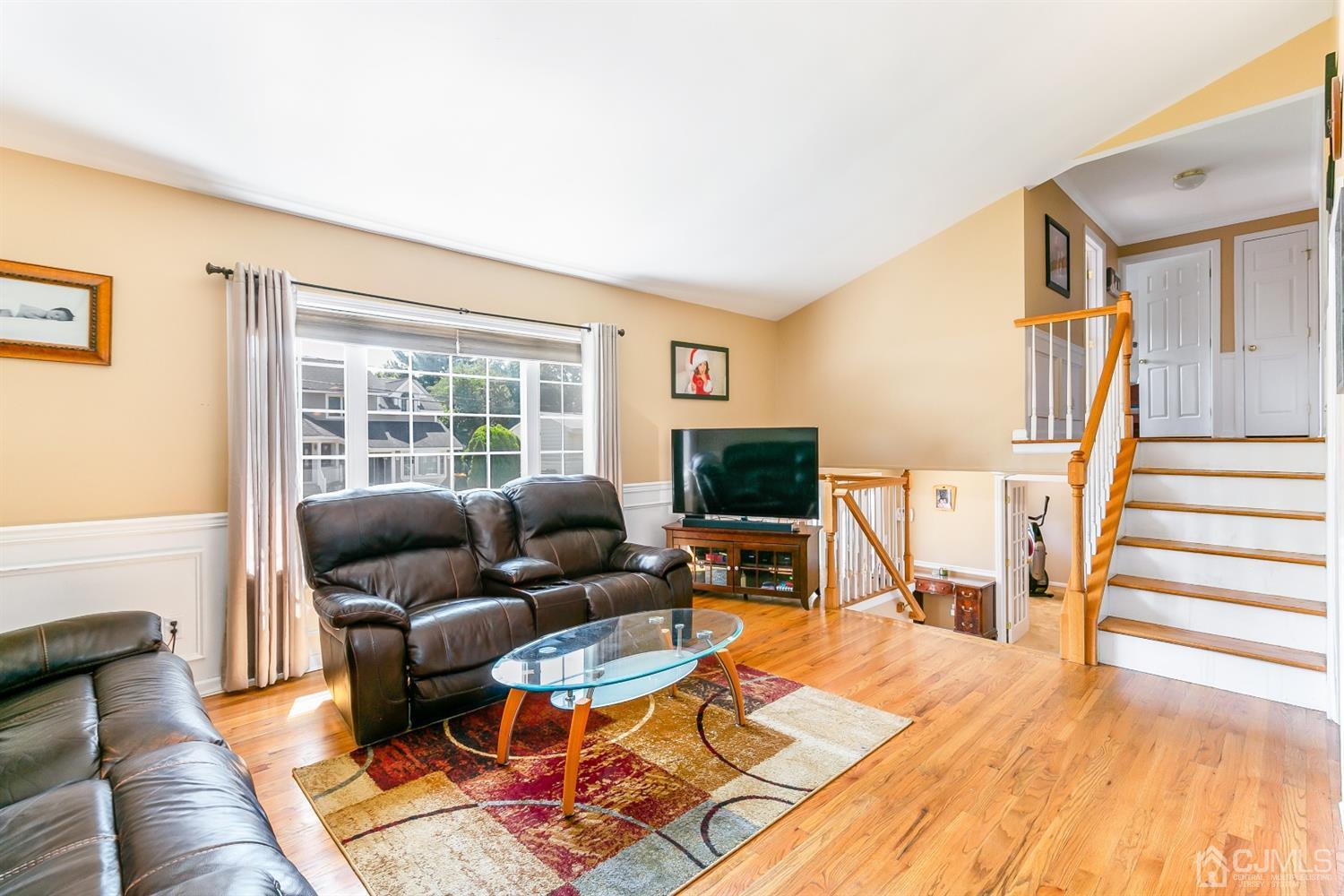 44 Gramercy Road Old Bridge, NJ 08857 - Photo 10 of 27 a living room with furniture and a flat screen tv