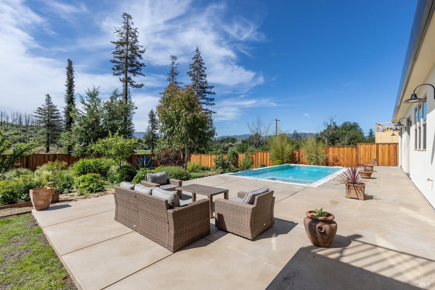 753 Sunnyside Road St. Helena, CA 94574 - Photo 42 of 55 a view of a swimming pool with a patio