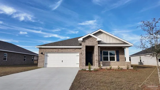 a front view of a house with a garage