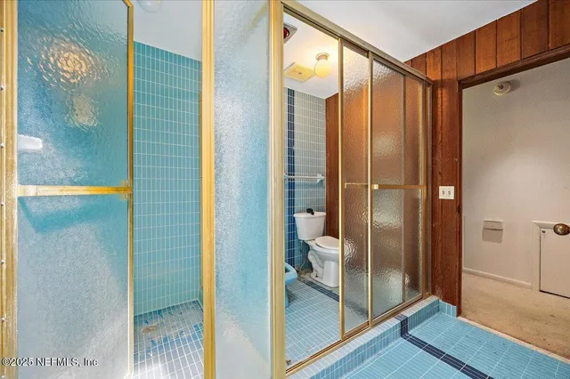 a room with wooden floor and window