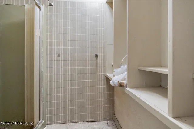 a front view of a house with a yard and outdoor seating