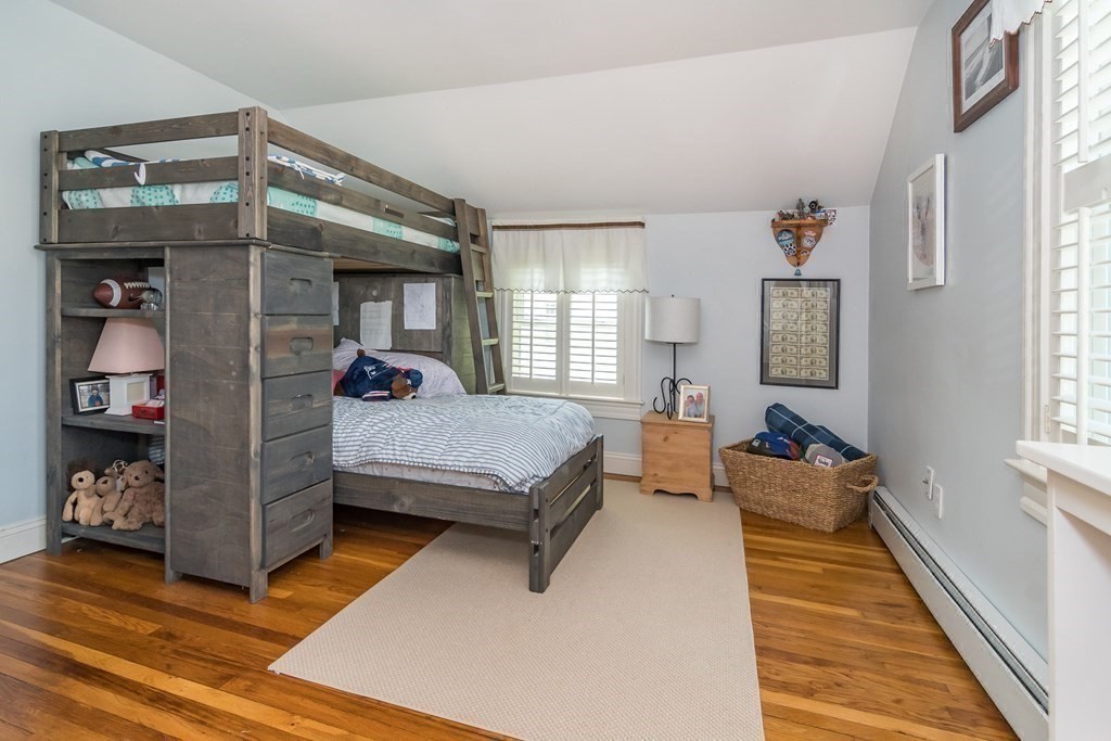 3 Claflin Road Wellesley, MA 02482 - Photo 12 of 20 a bedroom with a bed and a mirror on the dresser
