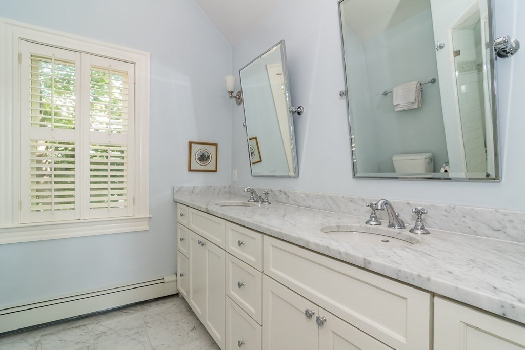 3 Claflin Road Wellesley, MA 02482 - Photo 15 of 20 a bathroom with double sink and a mirror