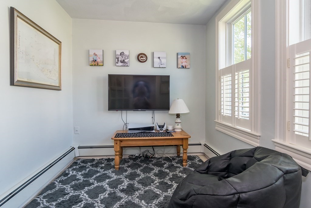 3 Claflin Road Wellesley, MA 02482 - Photo 3 of 20 a living room with furniture and a flat screen tv