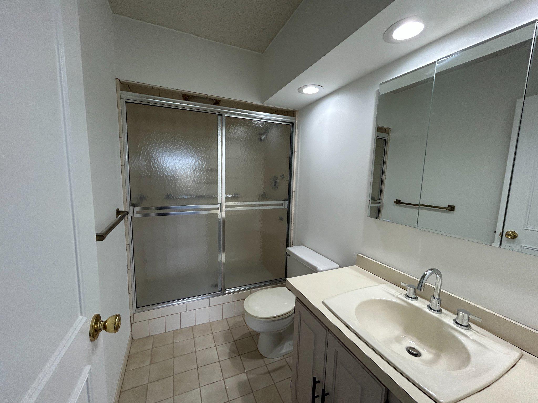860 Lower Ferry Road, Unit 6M Ewing, NJ 08628 - Photo 15 of 16 a bathroom with a sink toilet and shower