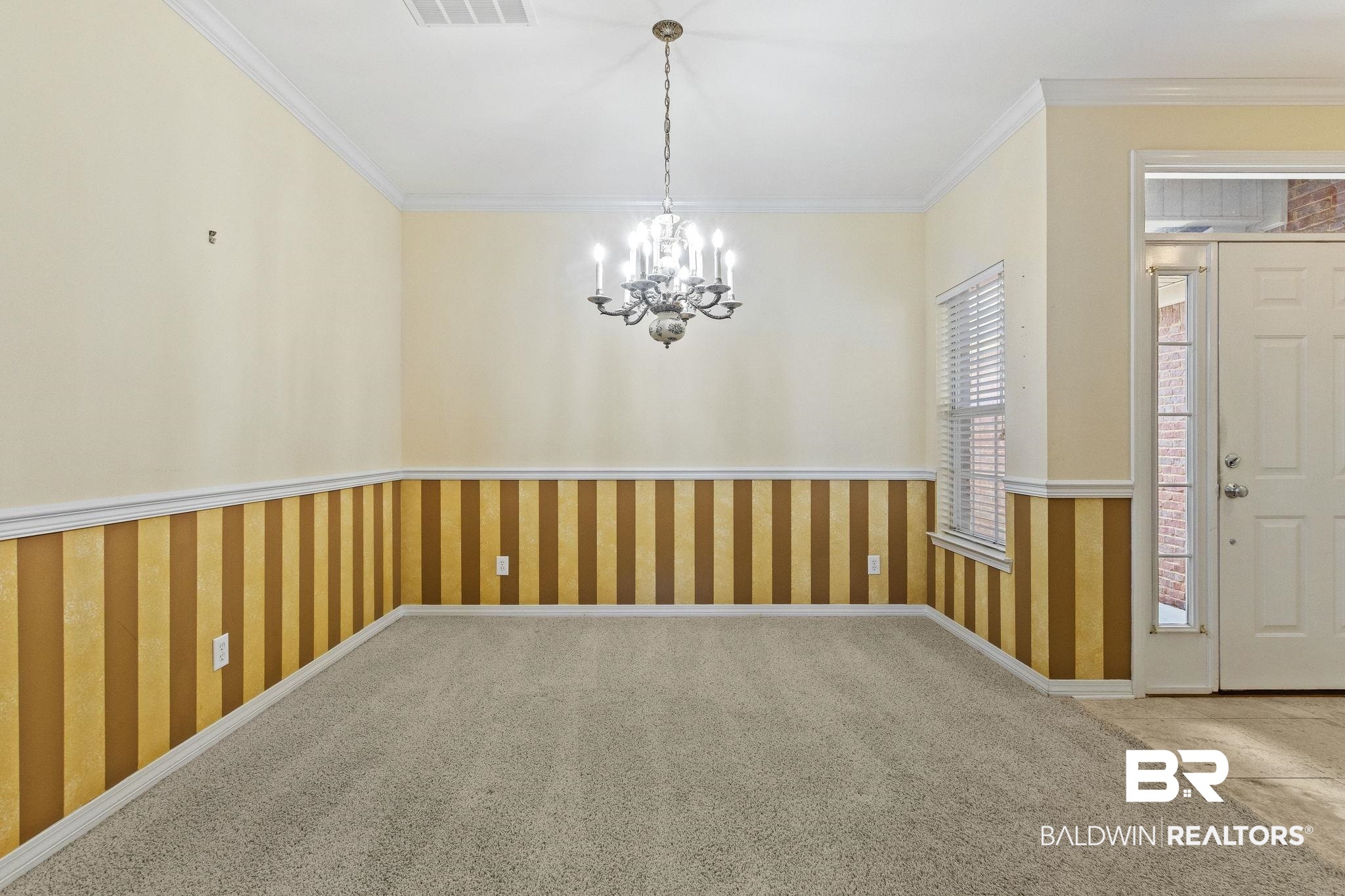 166 Club Drive Fairhope, AL 36532 - Photo 6 of 41 Interior space featuring crown molding, carpet flooring, and a notable chandelier
