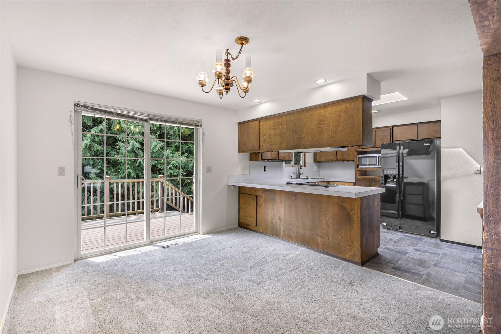 5925 Longdin Road Ferndale, WA 98248 - Photo 4 of 28 a kitchen with stainless steel appliances granite countertop a stove cabinets and living room view