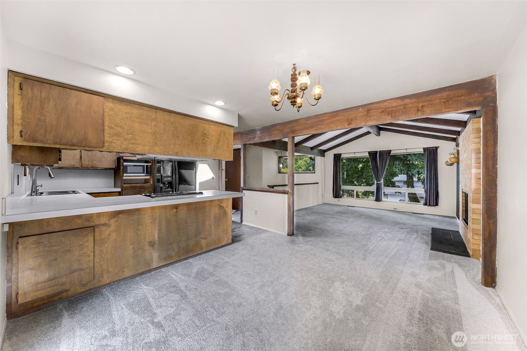 5925 Longdin Road Ferndale, WA 98248 - Photo 7 of 28 a view of a kitchen with a sink and dishwasher with wooden floor