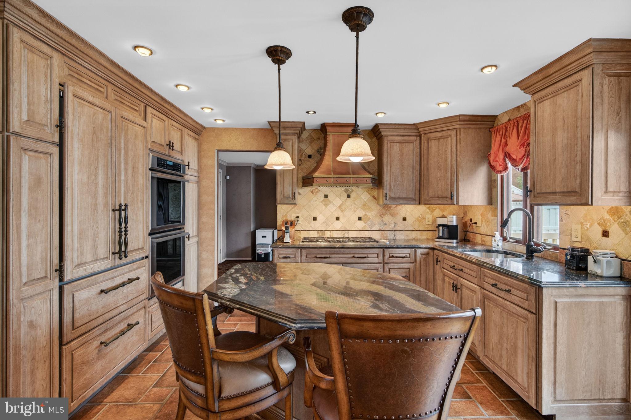 24 Millbridge Road Clementon, NJ 08021 - Photo 14 of 46 a kitchen with stainless steel appliances granite countertop a stove a sink dishwasher a refrigerator and cabinets with wooden floor