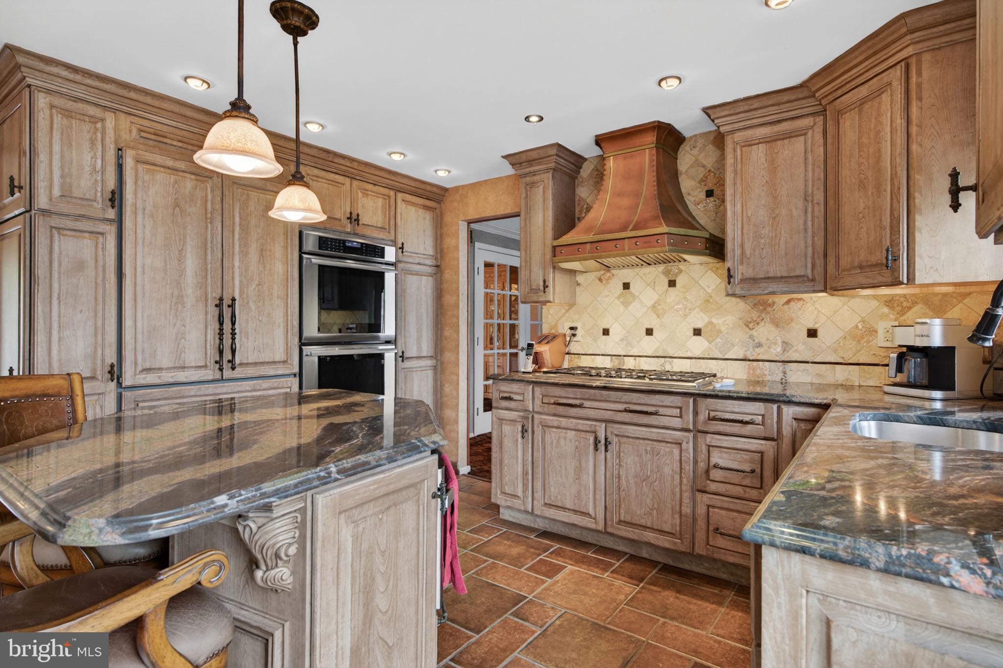 24 Millbridge Road Clementon, NJ 08021 - Photo 15 of 46 a kitchen with stainless steel appliances granite countertop a stove a sink and a microwave