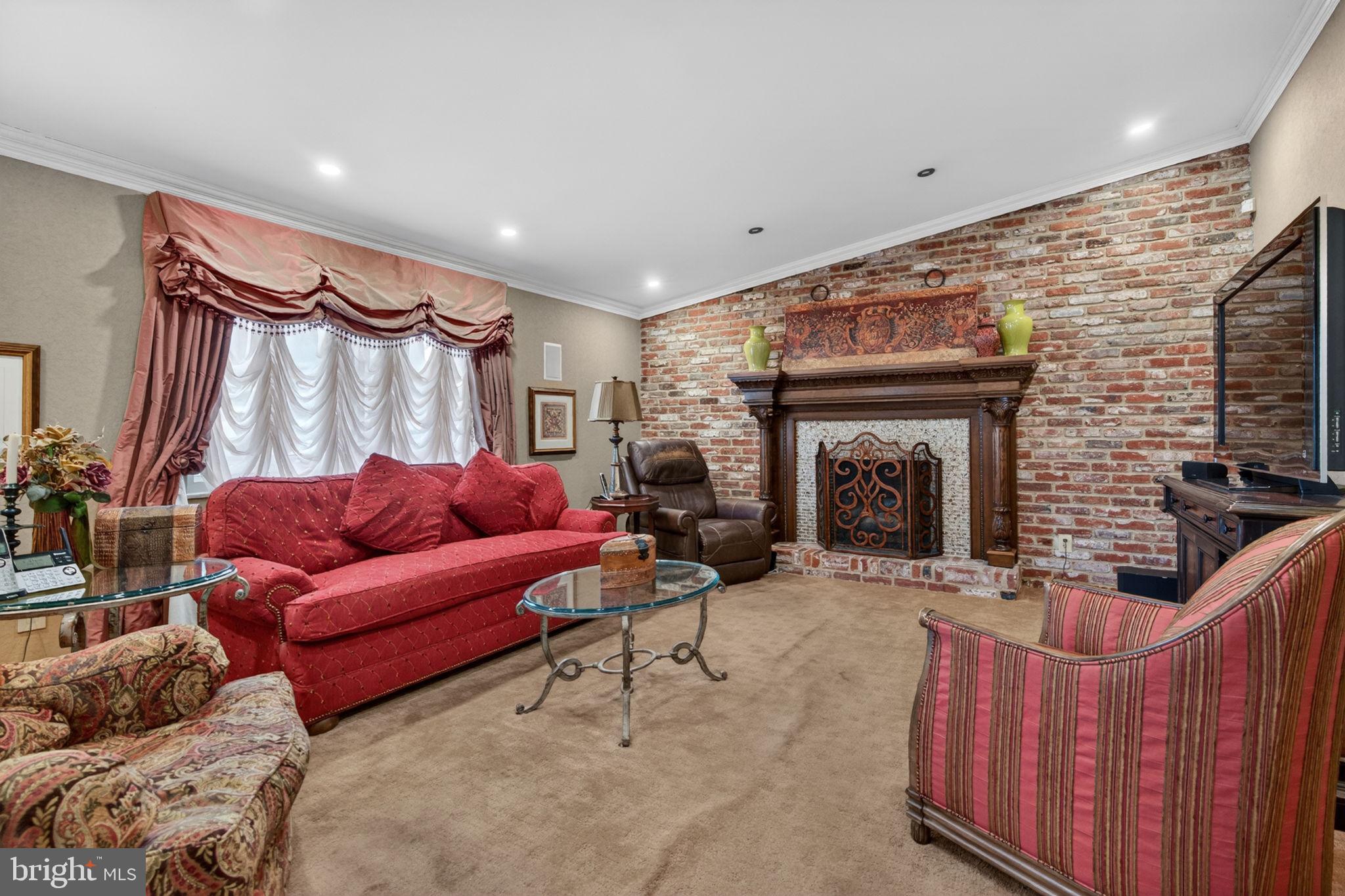 24 Millbridge Road Clementon, NJ 08021 - Photo 16 of 46 a living room with furniture a fireplace and a flat screen tv