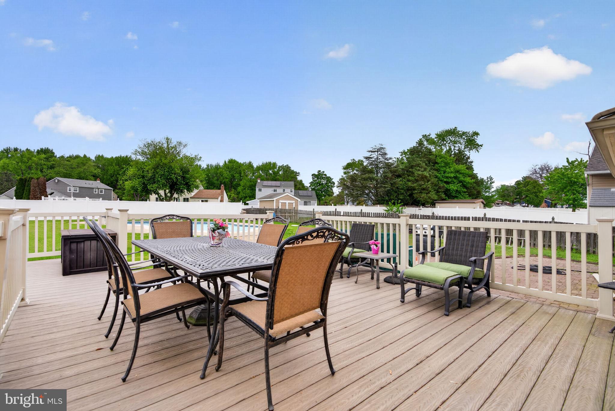 24 Millbridge Road Clementon, NJ 08021 - Photo 30 of 46 a view of a dinning table and chairs on deck with wooden floor