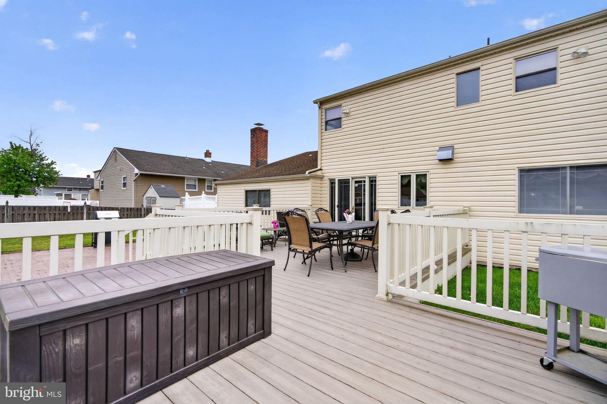 24 Millbridge Road Clementon, NJ 08021 - Photo 32 of 46 a view of a house with wooden deck and furniture