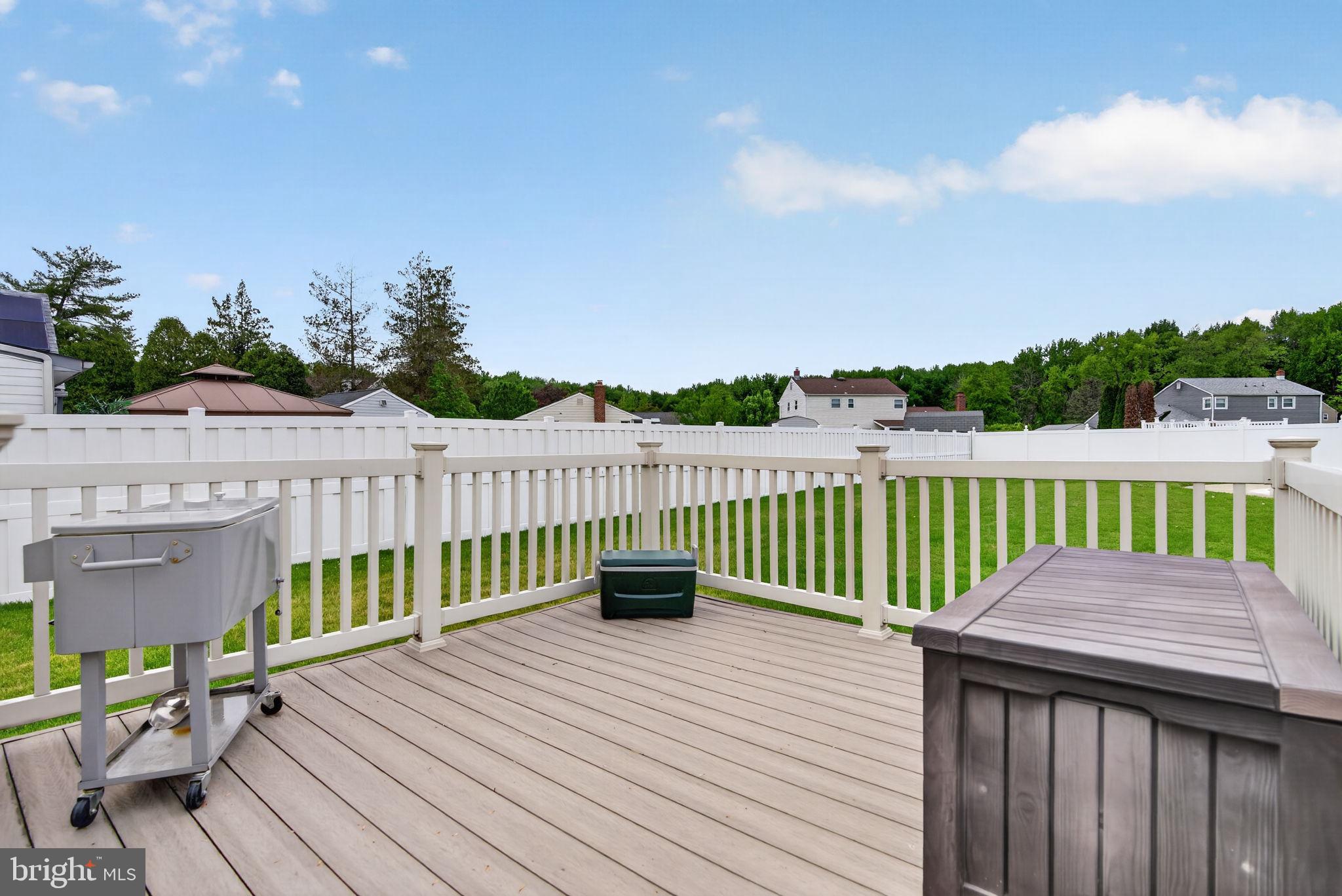 24 Millbridge Road Clementon, NJ 08021 - Photo 33 of 46 a view of a wooden deck with a bench