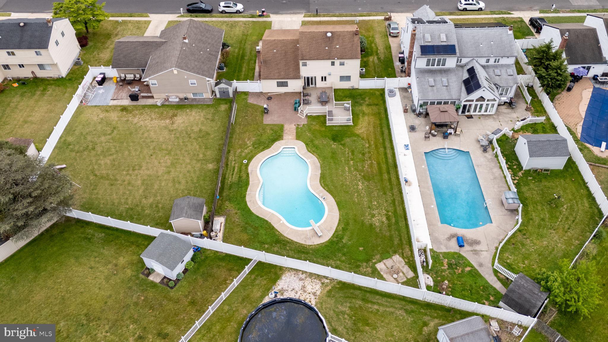 24 Millbridge Road Clementon, NJ 08021 - Photo 44 of 46 an aerial view of a swimming pool with outdoor seating