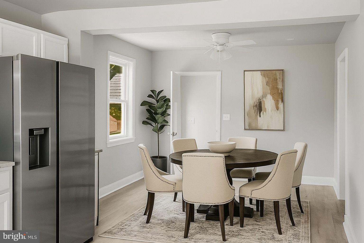 21305 Haven Road Rock Hall, MD 21661 - Photo 13 of 52 a view of a dining room with furniture window and wooden floor