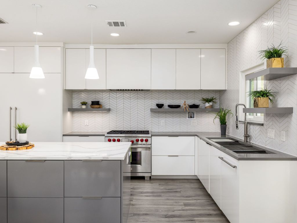 8004 Osborne Drive Austin, TX 78729 - Photo 11 of 24 a kitchen with stainless steel appliances granite countertop a sink stove and cabinets