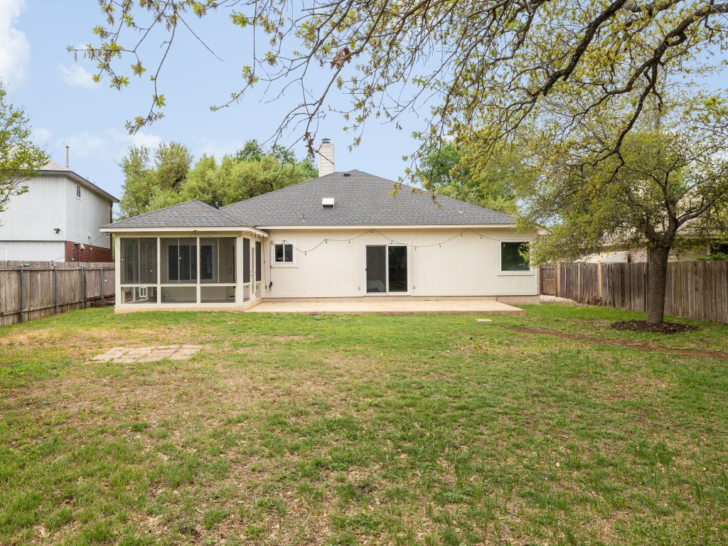 8004 Osborne Drive Austin, TX 78729 - Photo 19 of 24 a front view of a house with a garden