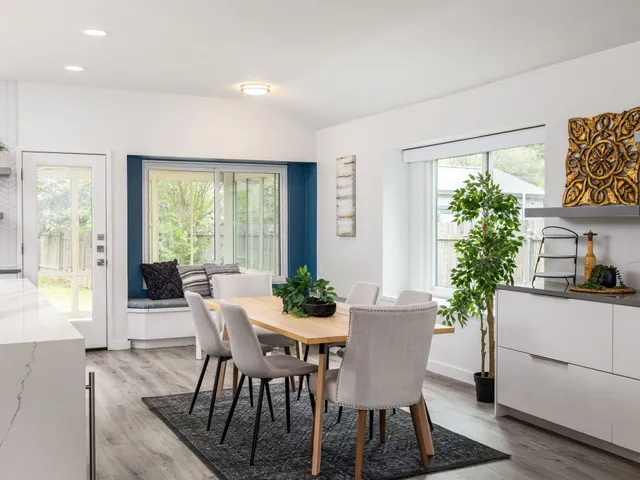 a view of a dining room with furniture window and outside view
