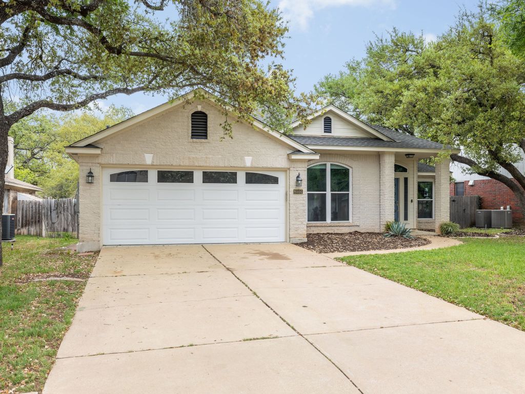 8004 Osborne Drive Austin, TX 78729 - Photo 24 of 24 a front view of house with yard and green space