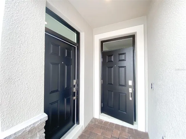 a metallic refrigerator freezer sitting in a kitchen