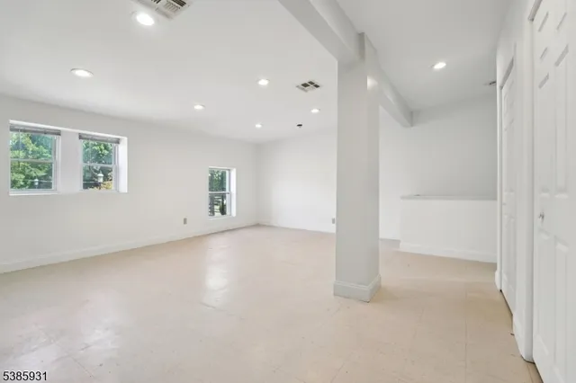 an empty room with windows