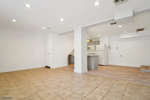 a view of a kitchen with a refrigerator
