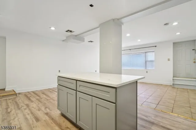 an empty room with wooden floor