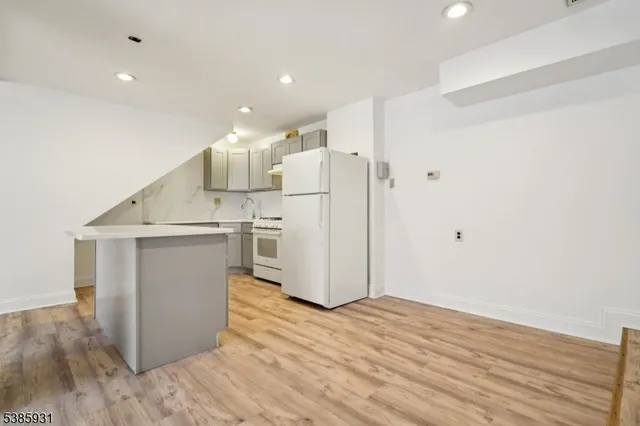 a view of kitchen with wooden floor