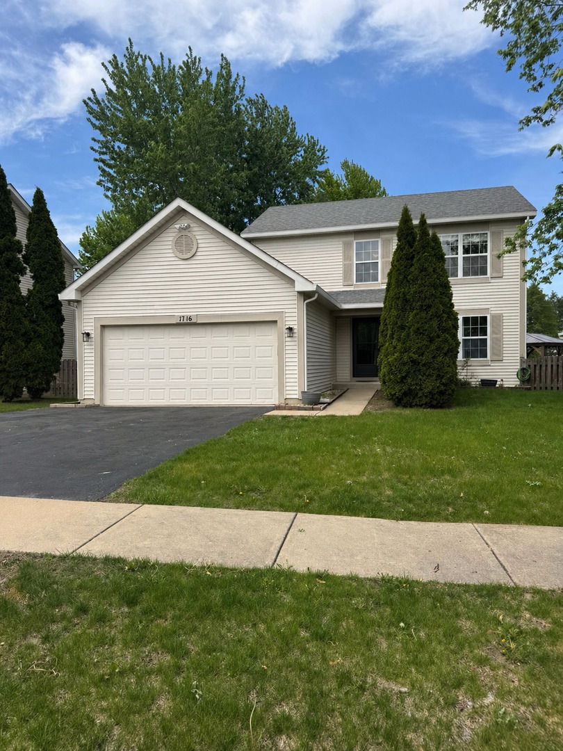 1716 William Drive Romeoville, IL 60446 - Photo 1 of 18 a view of outdoor space yard and front view of a house
