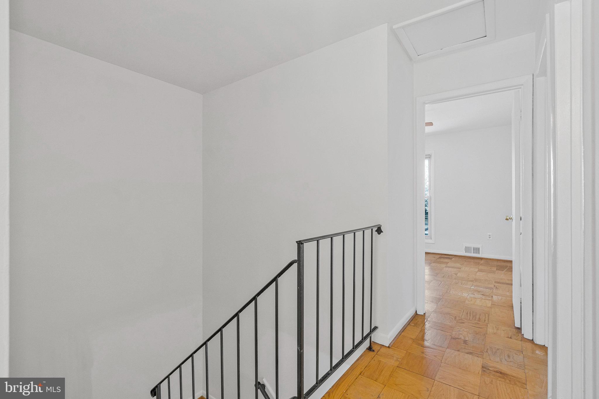 2131 Ferguson Place Herndon, VA 20170 - Photo 16 of 27 a view of a hallway with wooden floor