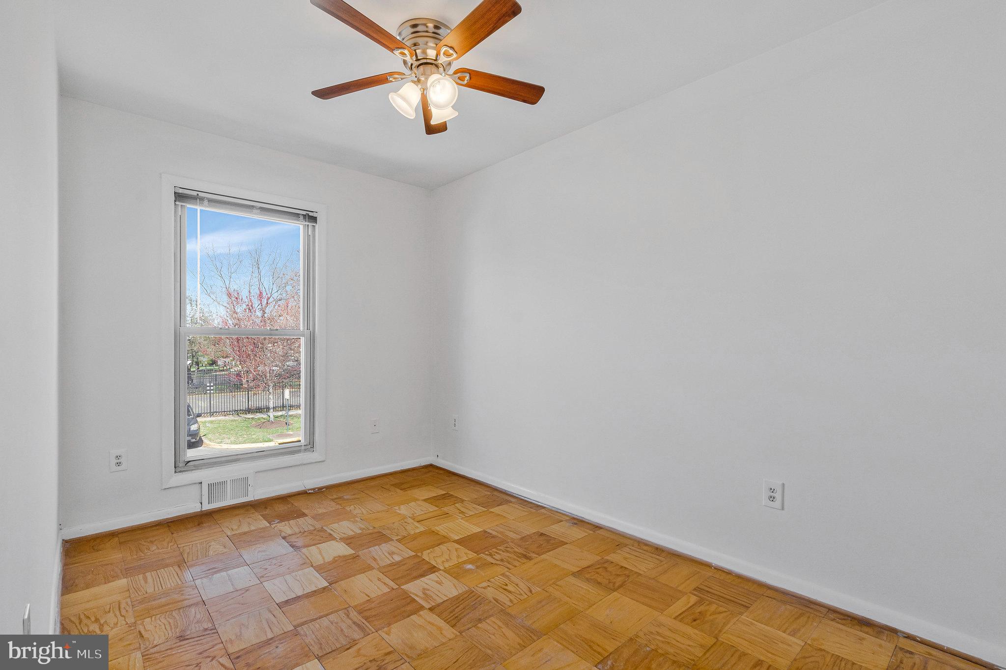 2131 Ferguson Place Herndon, VA 20170 - Photo 18 of 27 an empty room with windows and chandelier fan